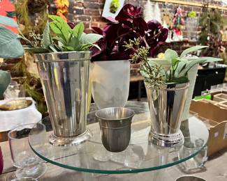 Round pieces of glass, metal vases and candle holders