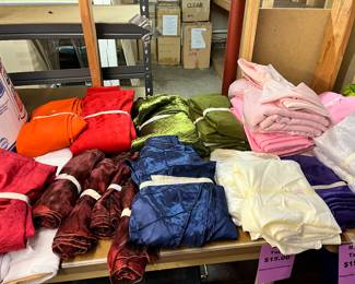 Large assortment of table clothes. 120” round, 90”round, and various sizes