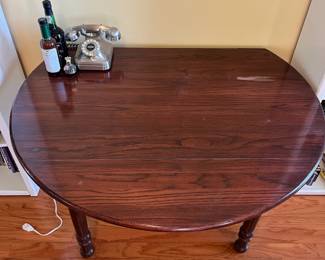 #10	Drop leaf round dining room table. Turned legs. *as is finish* 48" round x 30"	 $ 35.00 																							