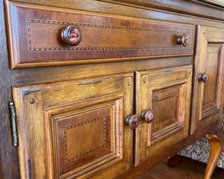 #4	"""Alexander Julian Home Colours"" Handcraft Antique Edwardian Inlaid Sideboard Credenza w/brass rail/trim. Silverware drawer, 4 doors. Queen Anne legs. 56x20x37 *small mark at bottom, pictured*"	 $ 500.00 																							