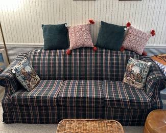 Plaid couch great pillows, wicker chest