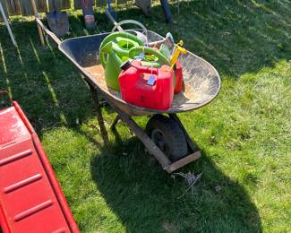 Wheel Barrel and gas containers plus watering cans