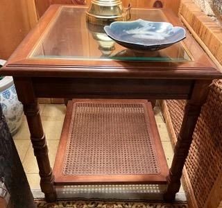 Wood and glass occasional table with caning, one of pair