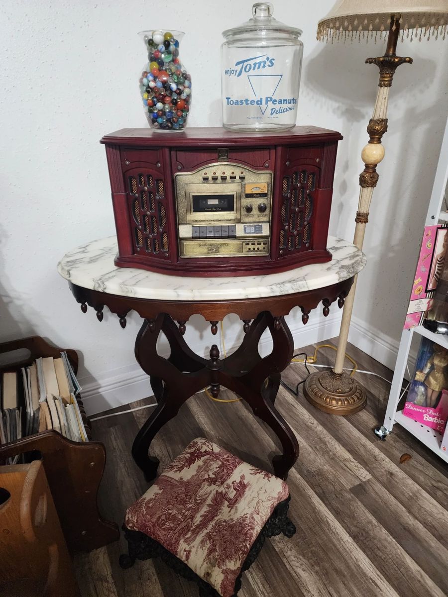 Every inch of this house is full! Here we go!! Antique Marble Top Table - Radio Record Player - Foot Stool - Vintage Marbles - Antique Tom's Peanut Jar