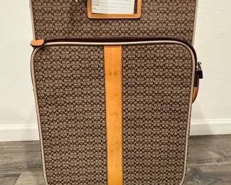 A wonderful coach carry-on, rollaway luggage piece only used a few times