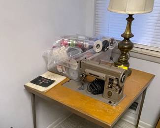 Sewing machine with table