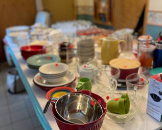 Many kitchen items such as dishes, glasses, glass bowl sets, pictures, mugs, pie plates etc.