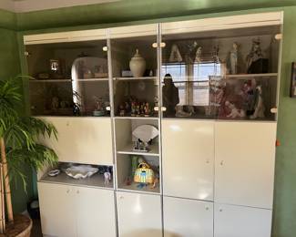 Wall unit full of LLadro/Hummels/Germany music boxes all from the countries visited