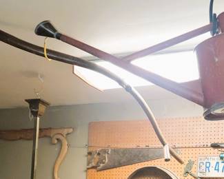 Old farm tools: sickle and watering can