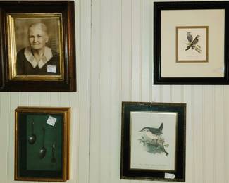 Framed portraits and magazine prints