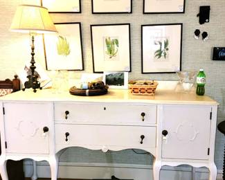 Painted buffet, wood basket, brass lamp, nature prints