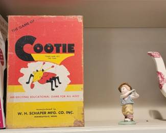 Mason transferware teapot with trivet, old books and Cootie game