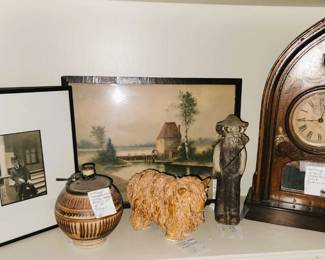 Old photographs, framed art, clay cow, unique mantle clock