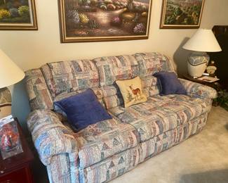 Lazy Boy recliner both ends with pull down snack table in center 