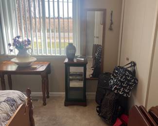 Luggage and small curio cabinet 