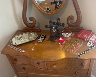 top of the dresser with costume jewelry 