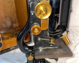 Bausch & Lomb  Brass Optical Microscope with case and extra lenses {black paint over brass parts can be removed} very heavy weight .  with light source no in photo 