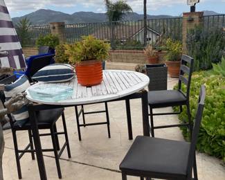 Metal framed table and 4 tall chairs