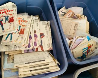 Two tubs of unused vintage sewing patterns. 