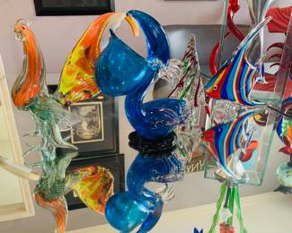 smaller pieces of art glass that include Pelicans, fish, and sea birds