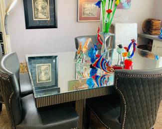 Totally mirrored table with two extra leaves not shown and four chairs.  I don't believe this was hardly used--The leaves are still wrapped in original paper