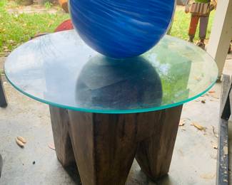 Carved wooden glass top table