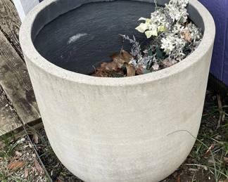 Pair of large concrete planting pots.