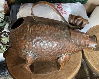 Metal pig watering can.