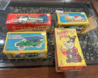 Mechanical toys in boxes.