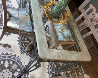 Iron base dining table with faux marble accent top. Base is topped off with beveled edge glass and 4 beautiful carved chairs(2 side 2 arm) with lovely upholstered seats. Set is in MINT CONDITION!   Priced at $600.00