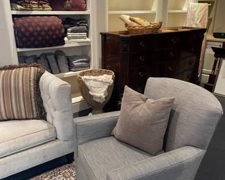 Another view of the Ethan Allen Swivel chairs with a pillow, King linens, large Drexel 12-drawer dresser with a marble top