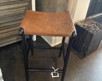 black-legged stool with cowhide