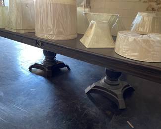 a double-pedestal table in dark chocolate, and on top - replacement lamp shades - all sizes 