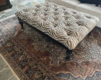 100% wool area rug hand-made/hand-tied fringe (118" x 94"); Ottoman with nailhead trim 