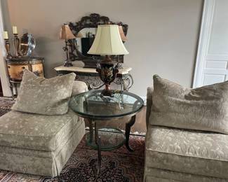 Matched set of 2 upholstered armchairs by Century with down back pillows; round metal and glass-topped side table with lower tier