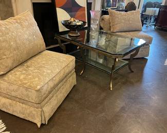 2- side chairs (matching couch also available), cocktail table with metal base with a glass top and lower tier, mid-modern lithograph, and decor items