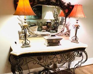 Iron with bronze finish and ivory fossil stone console table; Baroque mirror 