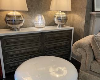 6-drawer dresser with soft-close drawers, large-scale silver lamps with ivory shades, white patent ottoman on casters