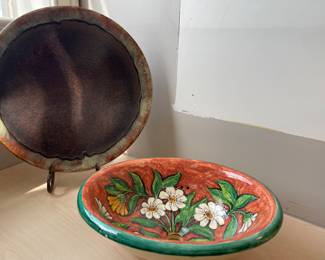 hand=painted ceramic sink and large pottery plate with plate stand