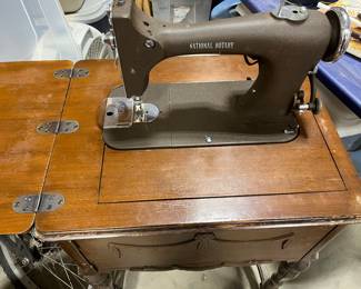 Vintage National Rotary sewing machine in cabinet