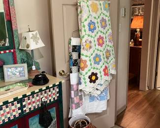 Painted dresser, vintage quilts and lamp shades