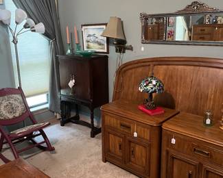 Vintage cabinet, folding rocker and vintage mirror with contemporary kine bed and nightstands. modern light with moving lamps and tiffinay style table lamp