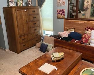 Contemporary chest matches king bed, cedar chest decor, vintage wall mirror and several small night stands