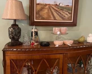 decor over a large glass cabinet with vintage items