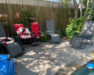 Pool and patio furniture, including rocking patio chairs. 