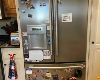 LG Smart refrigerator with water and ice on the door. Model LAFD25850TT