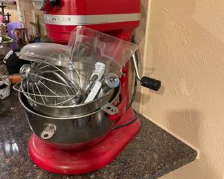 Red Kitchen Aid heavy duty standing mixer.