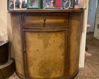 Half moon world map buffet with drawer and storage.