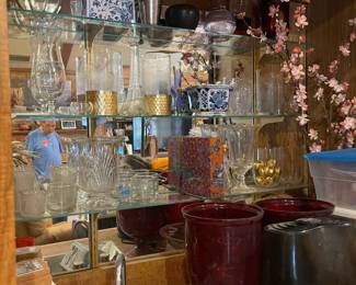 Dozens of vases of various colors - lots of red.