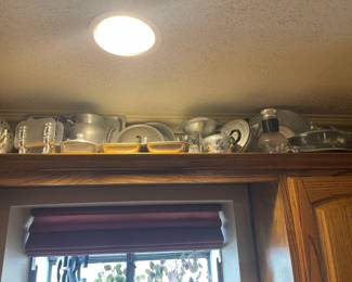 Dozens of hammered aluminum pieces.